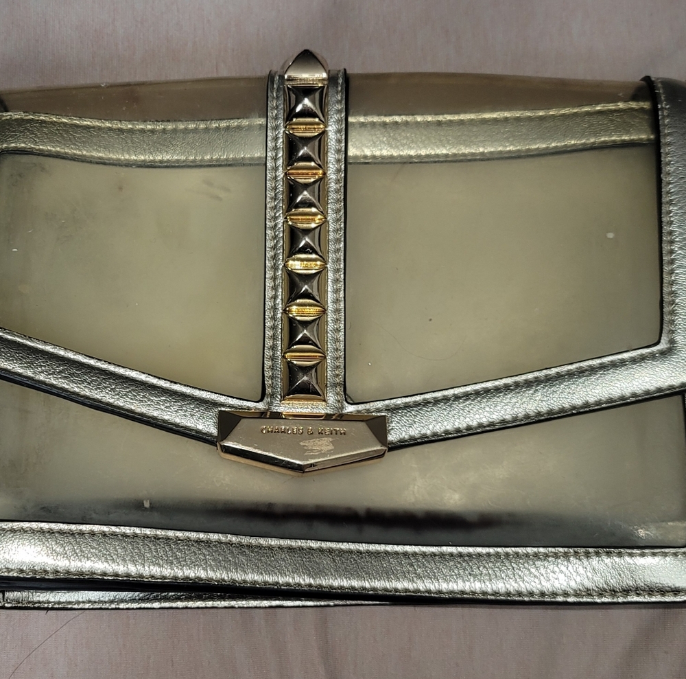 Charles and Keith Clear and Golden Studded Purse strap included